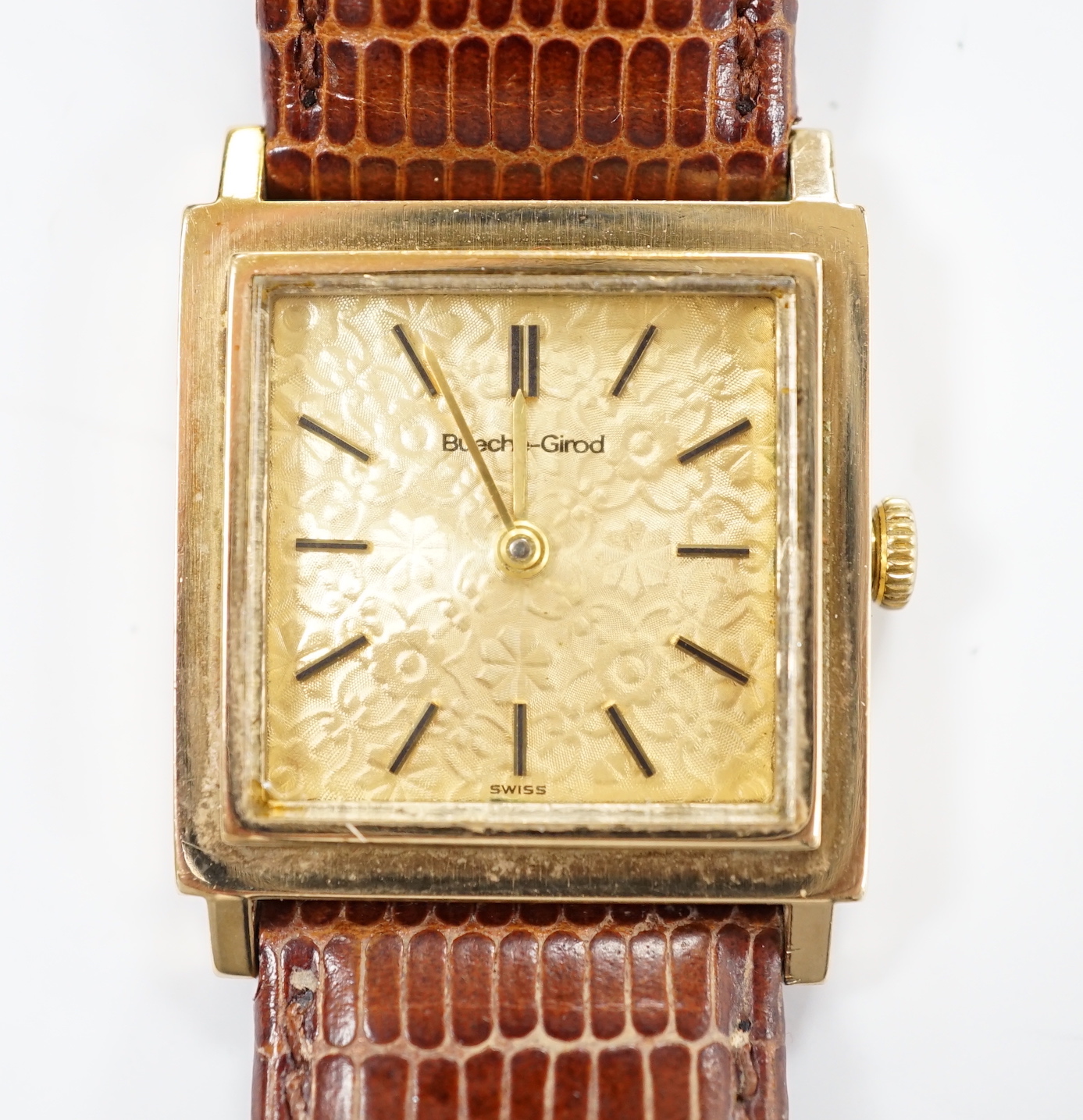 A gentleman's 9ct gold Bueche Girod manual wind square cased dress wrist watch, on a leather strap.